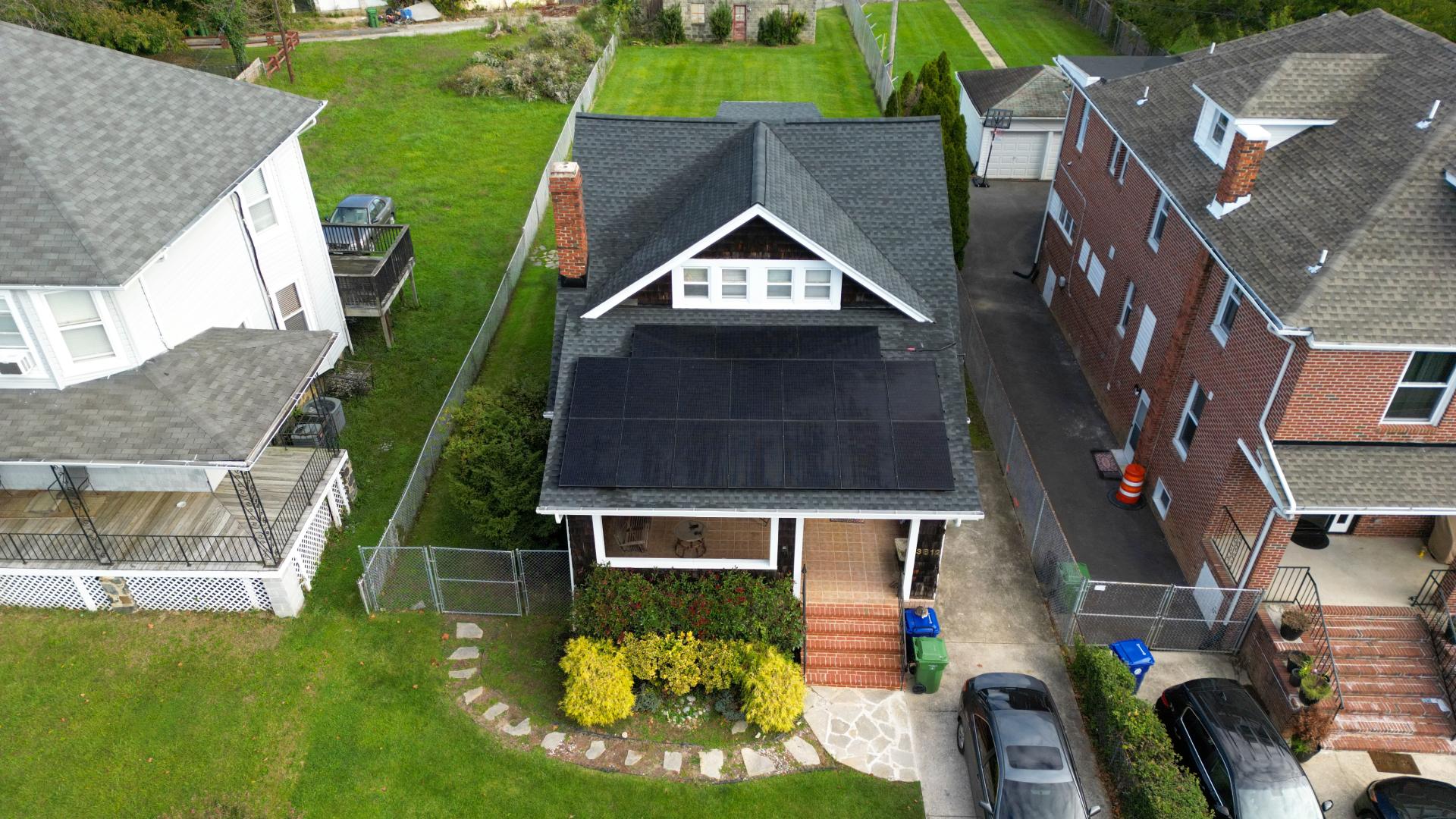 Aerial photo of solar panels on roof of small home