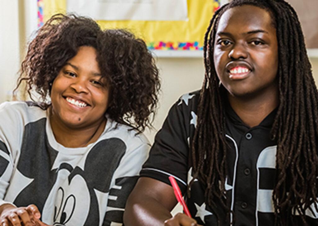 Joey Payne and Tykiera Simmons sitting in a classroom