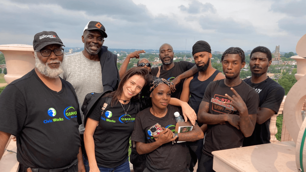 Members of the clean corps posing for a picture in matching tshirts