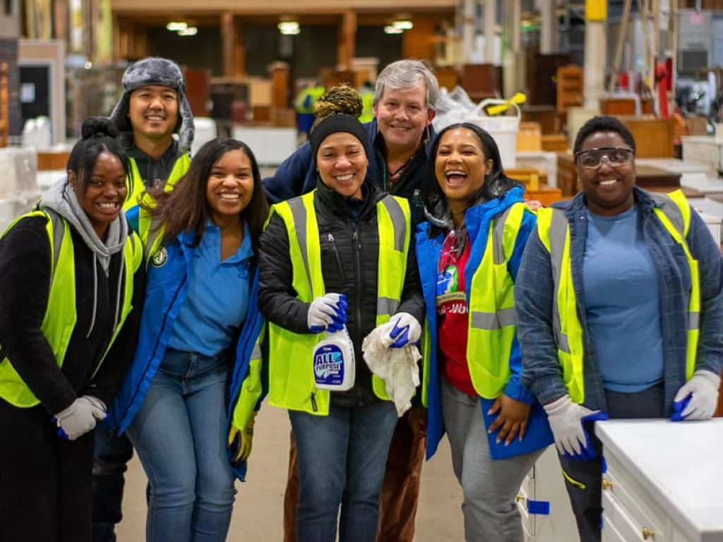 group of volunteers with cleaning materials at second chance