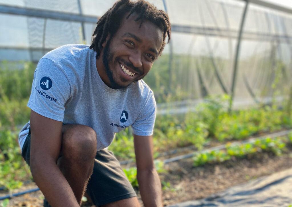 americorp member working in a garden